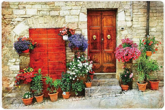 Lunarable Tuscan Pet Mat for Food and Water, Colorful Flowers Outside Home in Italian Hilltown Assisi Rustic Door Image, Non-Slip Rubber Mat for Dogs and Cats, 18" X 12", Orange Violet